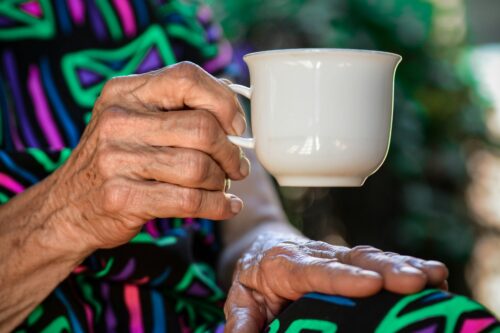 Lady holding a cup, representing HCRG Staffing's commitment to safeguarding