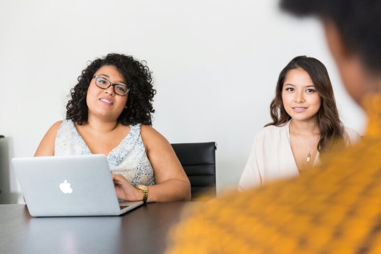 Recruitment consultant discussing job opportunities with a candidate, inviting you to join our team at HCRG Staffing.